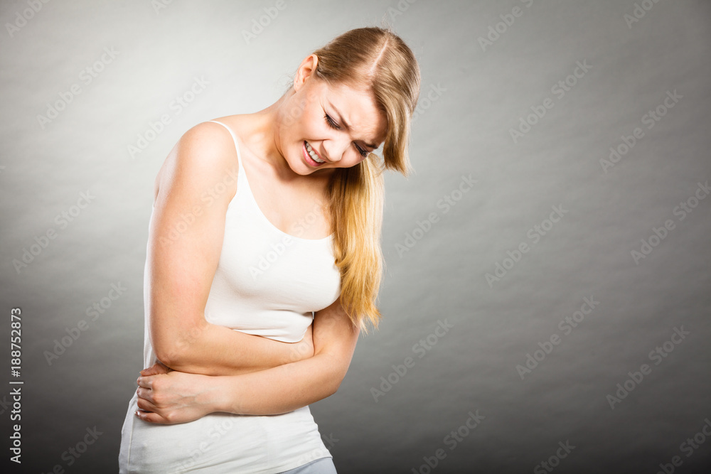Woman suffer from belly pain. Woman suffer from belly pain.