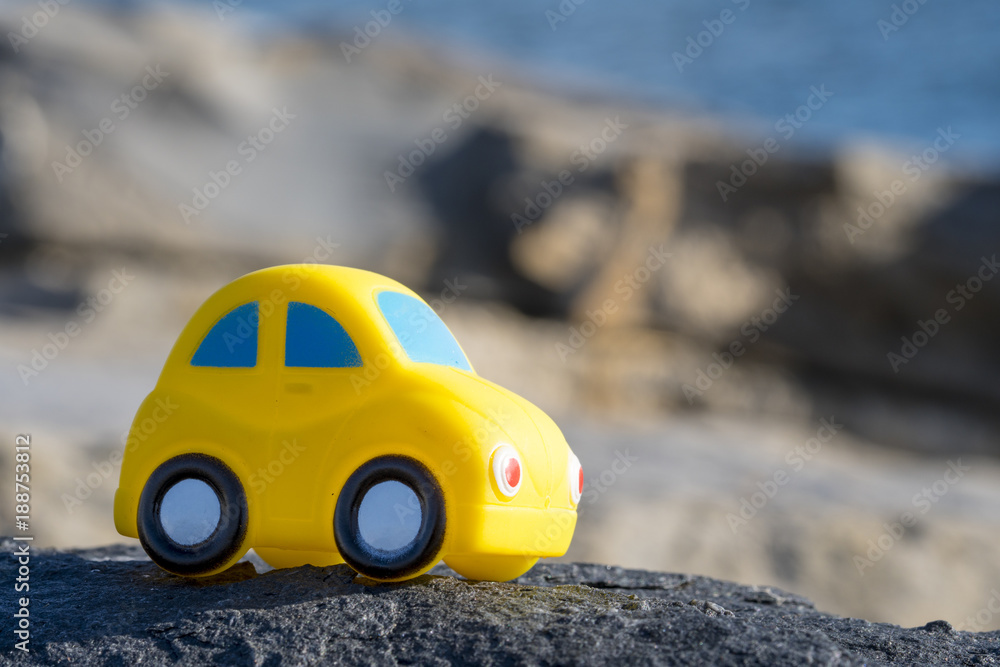 Toy Car near the sea. Travel, tourism, holiday and adventure concept. Toy Car near the sea. Travel, tourism, holiday and adventure concept.