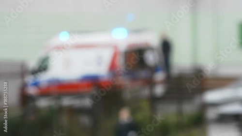 Blurred ambulance waiting for a patient