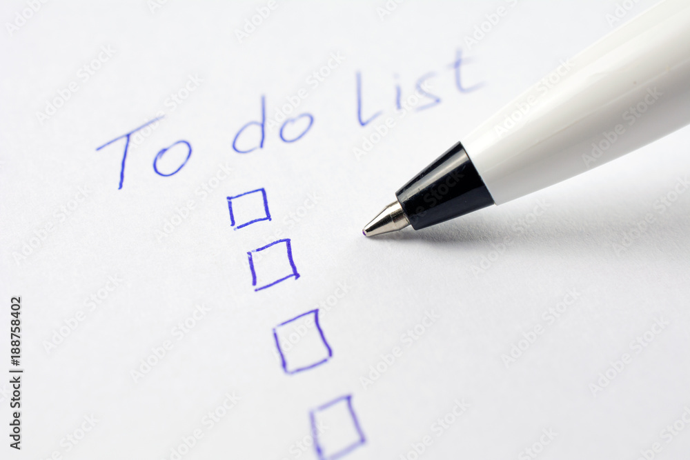 to do list on a white sheet of paper, pen notes completed check box. self management concept, close up, selective focus to do list on a white sheet of paper, pen notes completed check box. self management concept, close up, selective focus