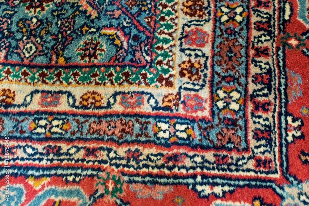 Closeup of an oriental rug with right angle motif