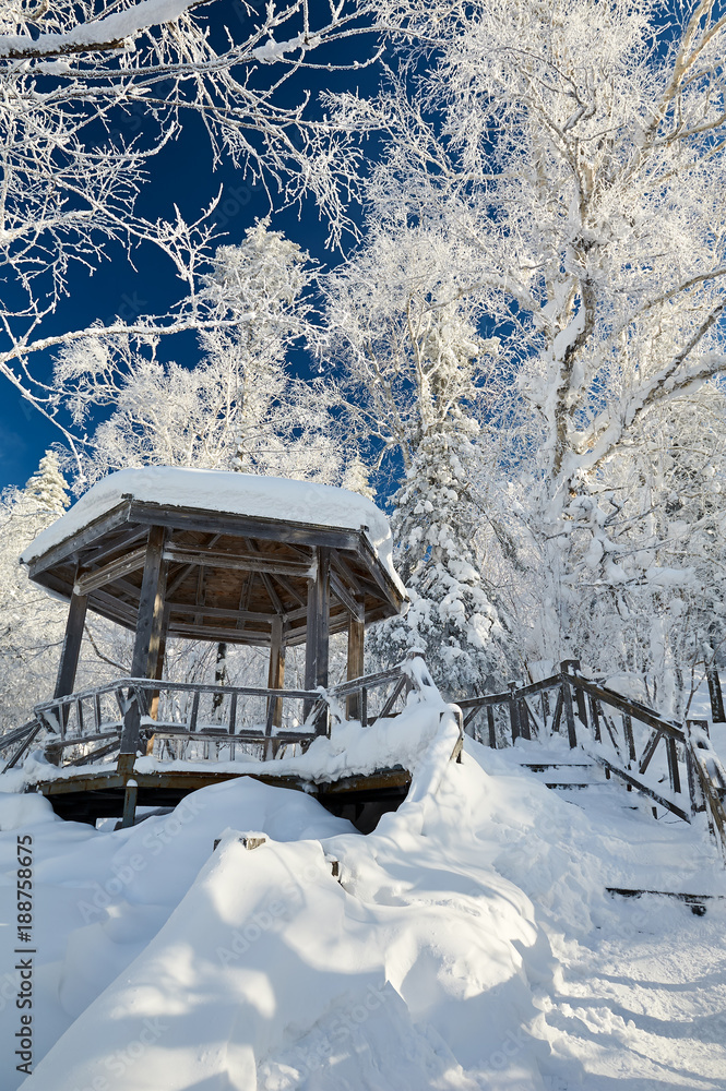 The wooden gallery road in the winter mountain The wooden gallery road in the winter mountain