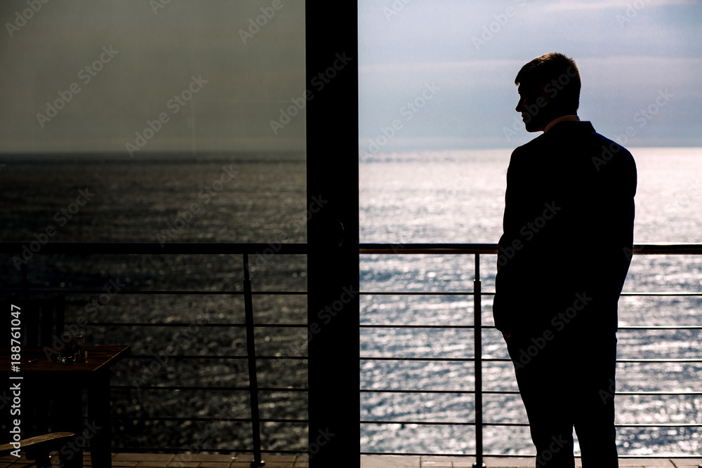 silhouette of a man against the sea, business silhouette of a man against the sea, business