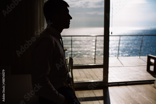 silhouette of a man against the sea, business