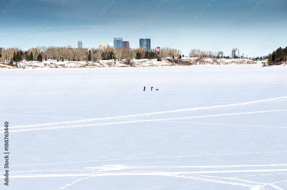 Cross-country skiing on a frozen lake in the city