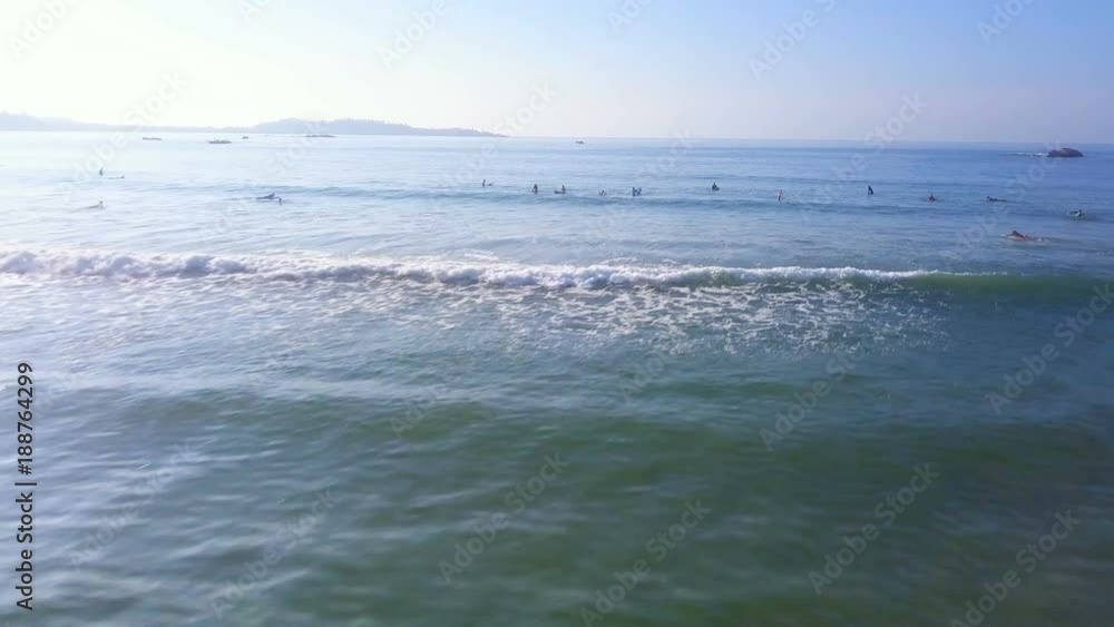 Aerial view surfers waiting for waves in lineup drone footage Aerial view surfers waiting for waves in lineup drone footage