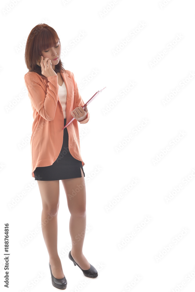 Portrait full body of young businesswoman in suit holding red file and use smartphone isolated on white background. Asian woman on white background. Free from copy space. Portrait full body of young businesswoman in suit holding red file and use smartphone isolated on white background. Asian woman on white background. Free from copy space.