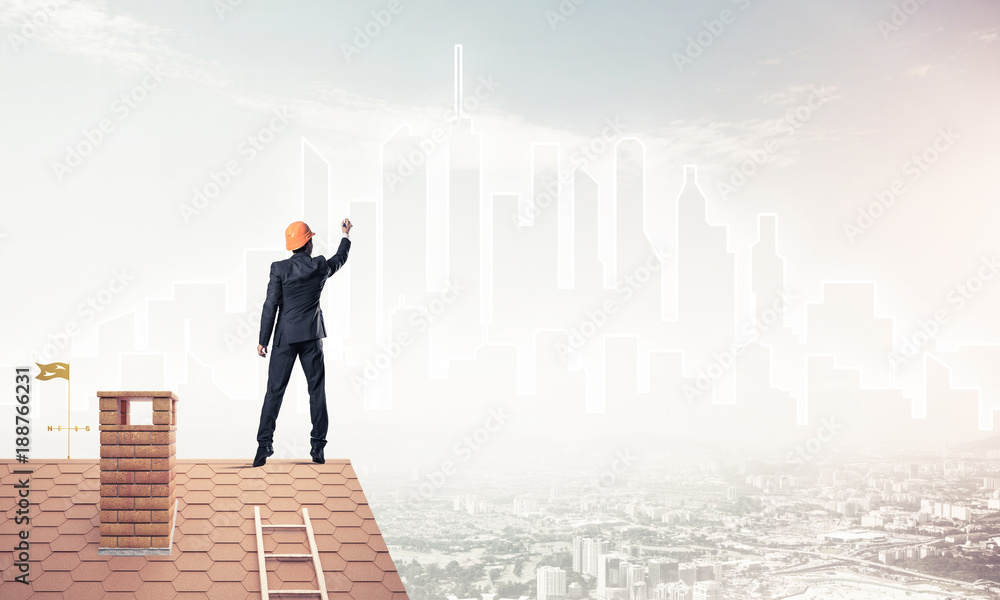 Man architect draw silhouette of modern city on blue sky. Mixed Man architect draw silhouette of modern city on blue sky. Mixed