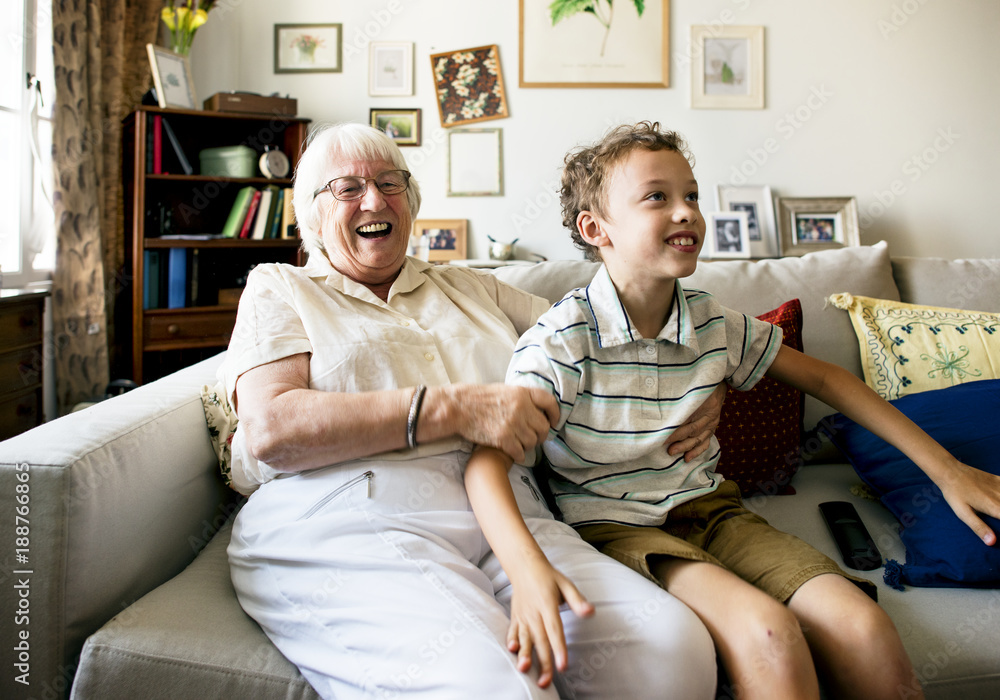 Grandma and grandson sitting on the sofa together Grandma and grandson sitting on the sofa together