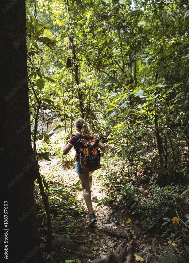 Woman trekking in the forest Woman trekking in the forest