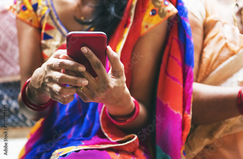 Indian woman using mobile phone photo