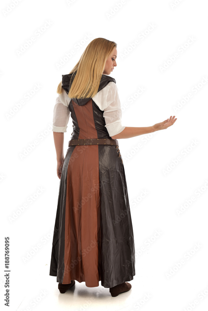 full length portrait of girl wearing brown fantasy costume, standing pose with back to the camera on white studio background. full length portrait of girl wearing brown fantasy costume, standing pose with back to the camera on white studio background.