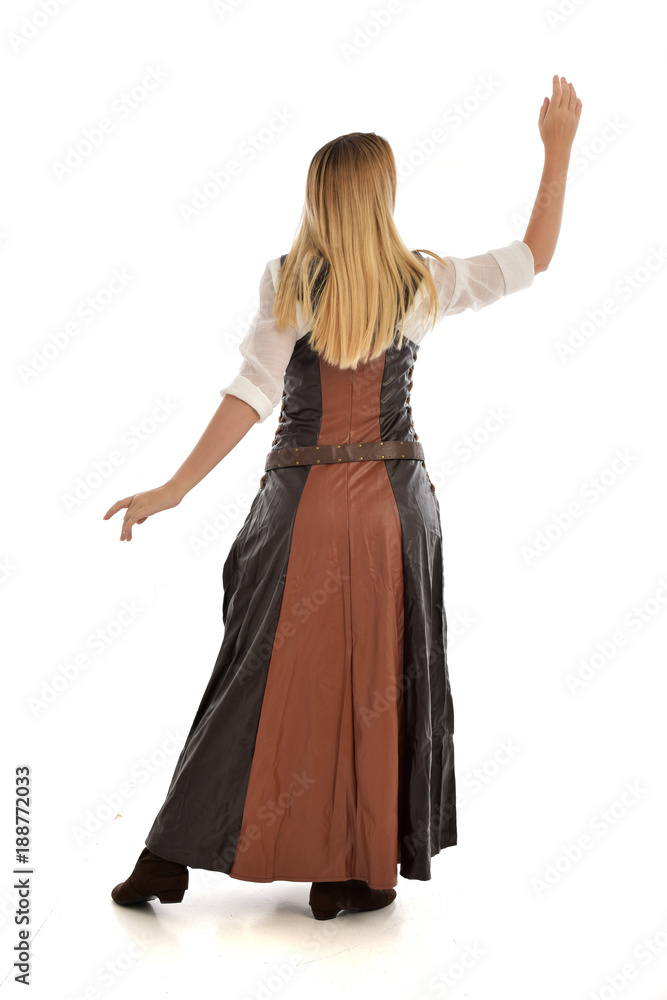 full length portrait of girl wearing brown  fantasy costume, standing pose with back to the camera on white studio background. 