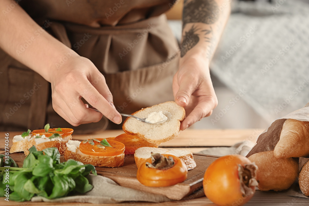 Woman preparing delicious bruschettas on table Woman preparing delicious bruschettas on table