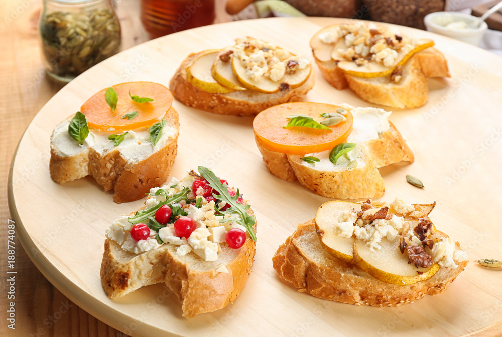 Woman preparing delicious bruschettas on table Woman preparing delicious bruschettas on table