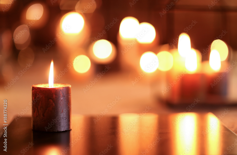 Burning candle on board indoors Burning candle on board indoors
