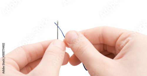 Woman threading needle on white background  closeup