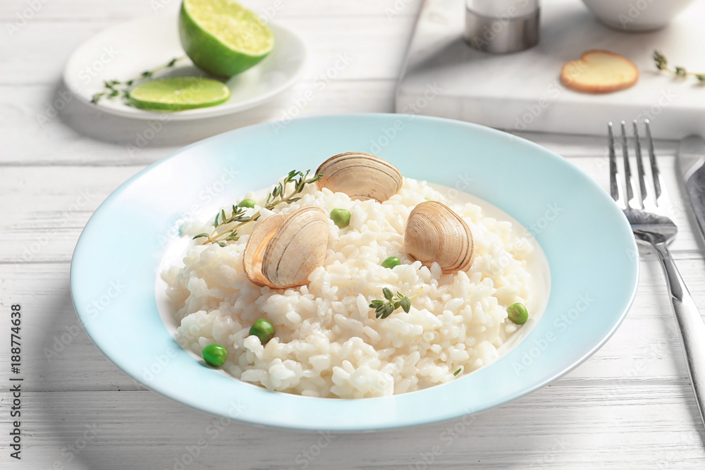Plate with tasty seafood risotto on table Plate with tasty seafood risotto on table