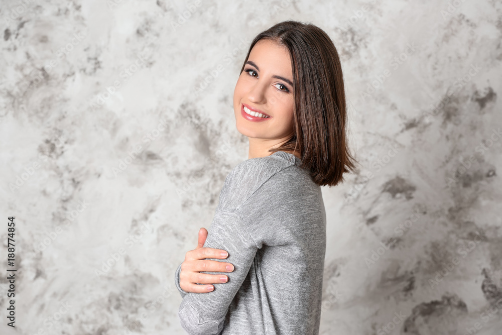 Young smiling woman on light background Young smiling woman on light background