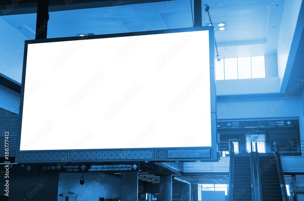 Obraz premium big lcd tv screen, blank advertising billboard or light box showcase at airport or subway train station, copy space for your text message or media content, advertisement, commercial, marketing concept
