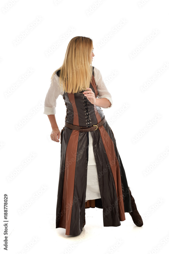 full length portrait of girl wearing brown fantasy costume, standing pose with back to the camera on white studio background. full length portrait of girl wearing brown fantasy costume, standing pose with back to the camera on white studio background.