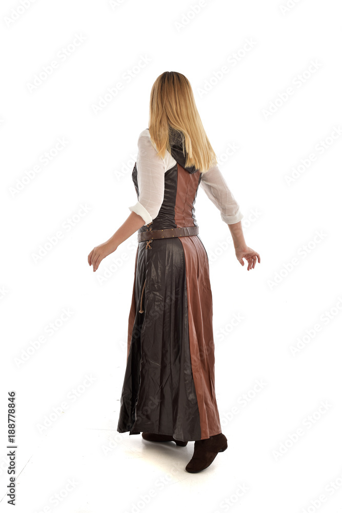 full length portrait of girl wearing brown  fantasy costume, standing pose with back to the camera on white studio background. 