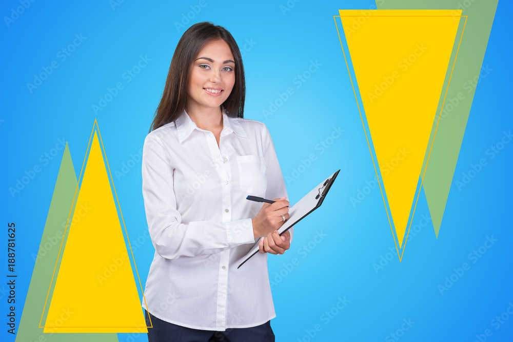 young business woman standing with her clipboard young business woman standing with her clipboard