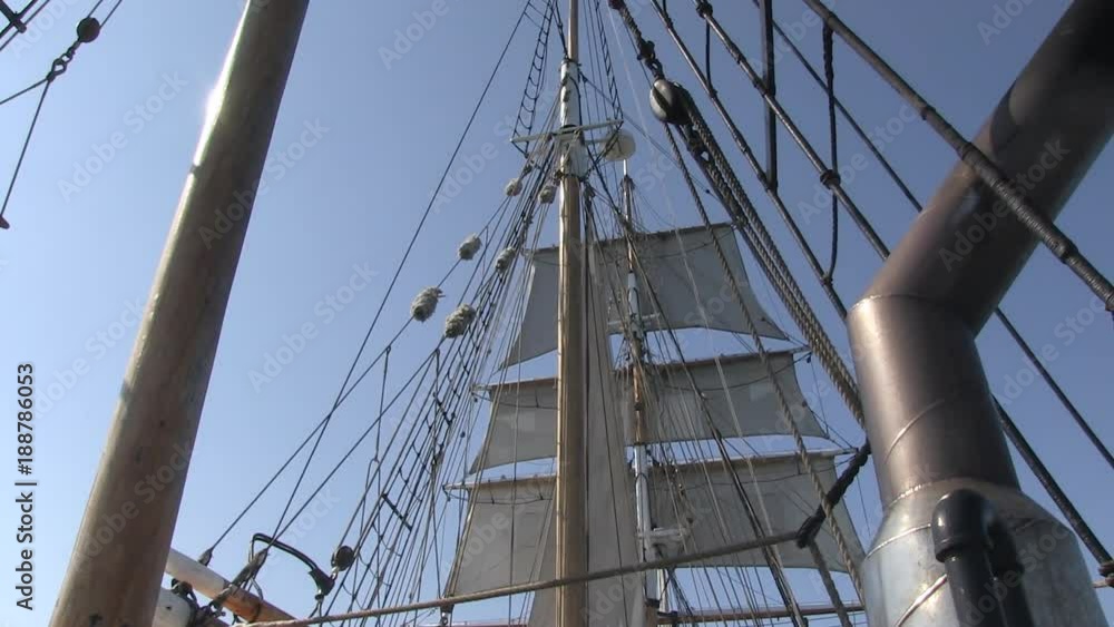 A worms eye view shot of a ship's sail. camera tilts up and down A worms eye view shot of a ship's sail. camera tilts up and down
