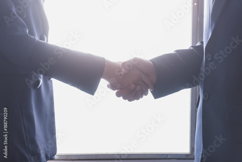 Businessmen shake hands. Two confident businesswoman and businesmen hands shaking after good deal,Successful business partnership meeting photo