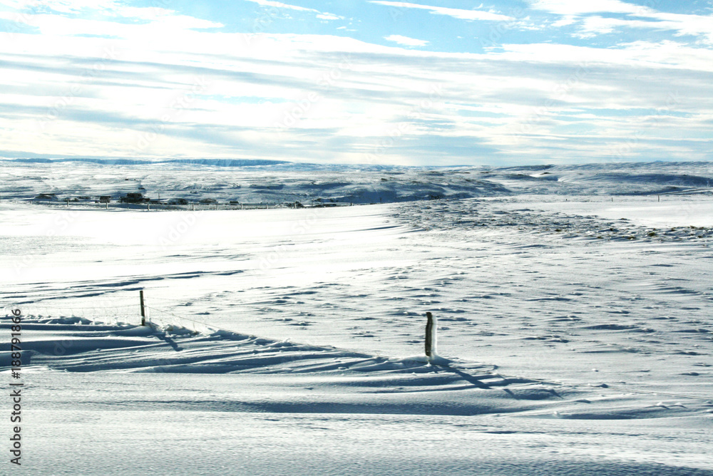 Cloudy sky and snow covered landscape in Iceland Cloudy sky and snow covered landscape in Iceland