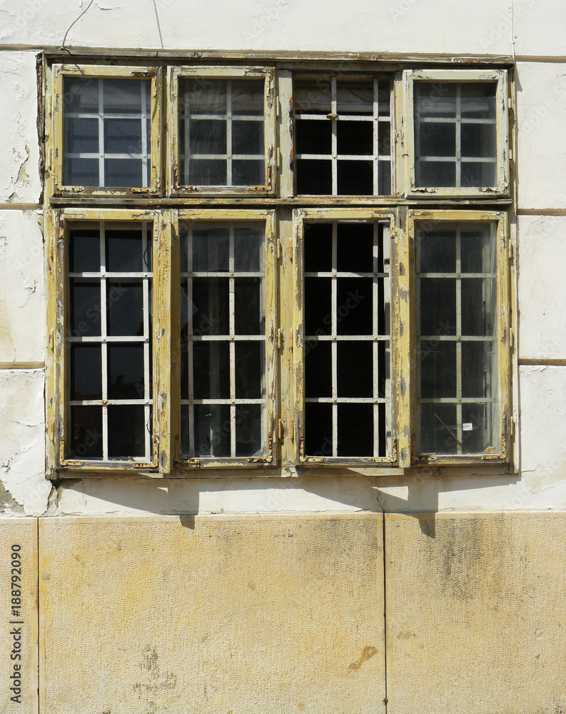 Old wood windows in the downtown of Pecs city, Hungary