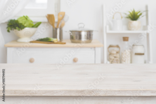 Table top and defocused kitchen interior as background © didecs