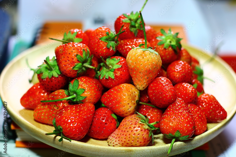 Close up, Top view, Fresh strawberries on the wooden plate Close up, Top view, Fresh strawberries on the wooden plate