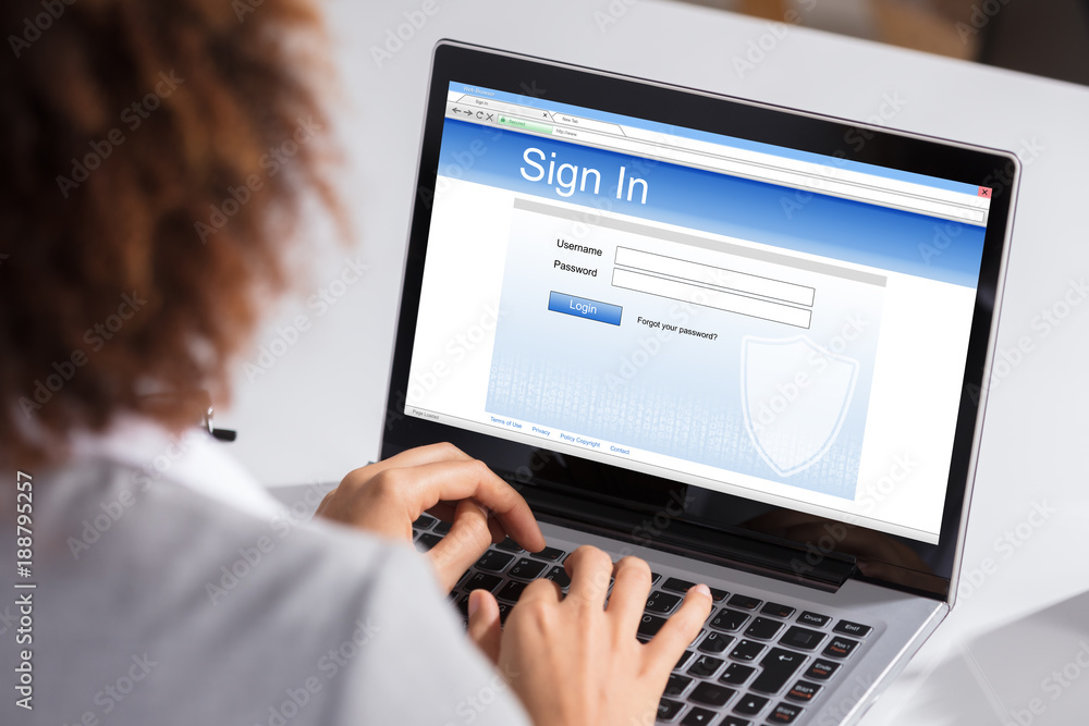 Businesswoman Signing Into Website On Laptop Businesswoman Signing Into Website On Laptop