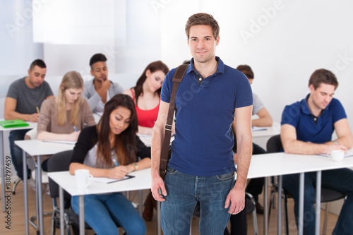 Confident Male Student Carrying Bag