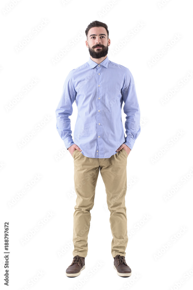 Front view of young beard smart casual business man with hands in pockets. Full body length portrait isolated on white studio background. Front view of young beard smart casual business man with hands in pockets. Full body length portrait isolated on white studio background.