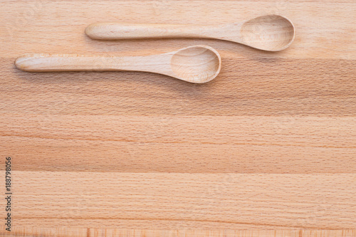 Wooden spoon on wooden background