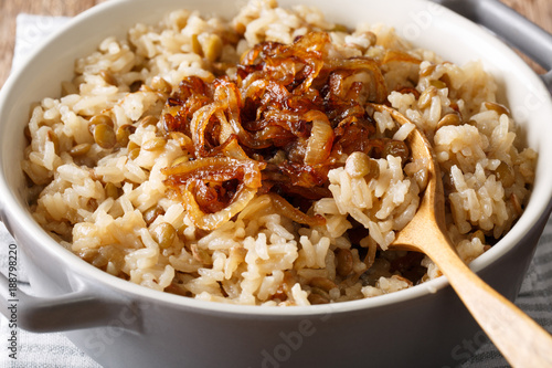 Vegetarian food: rice with lentils and caramelized onion macro. horizontal