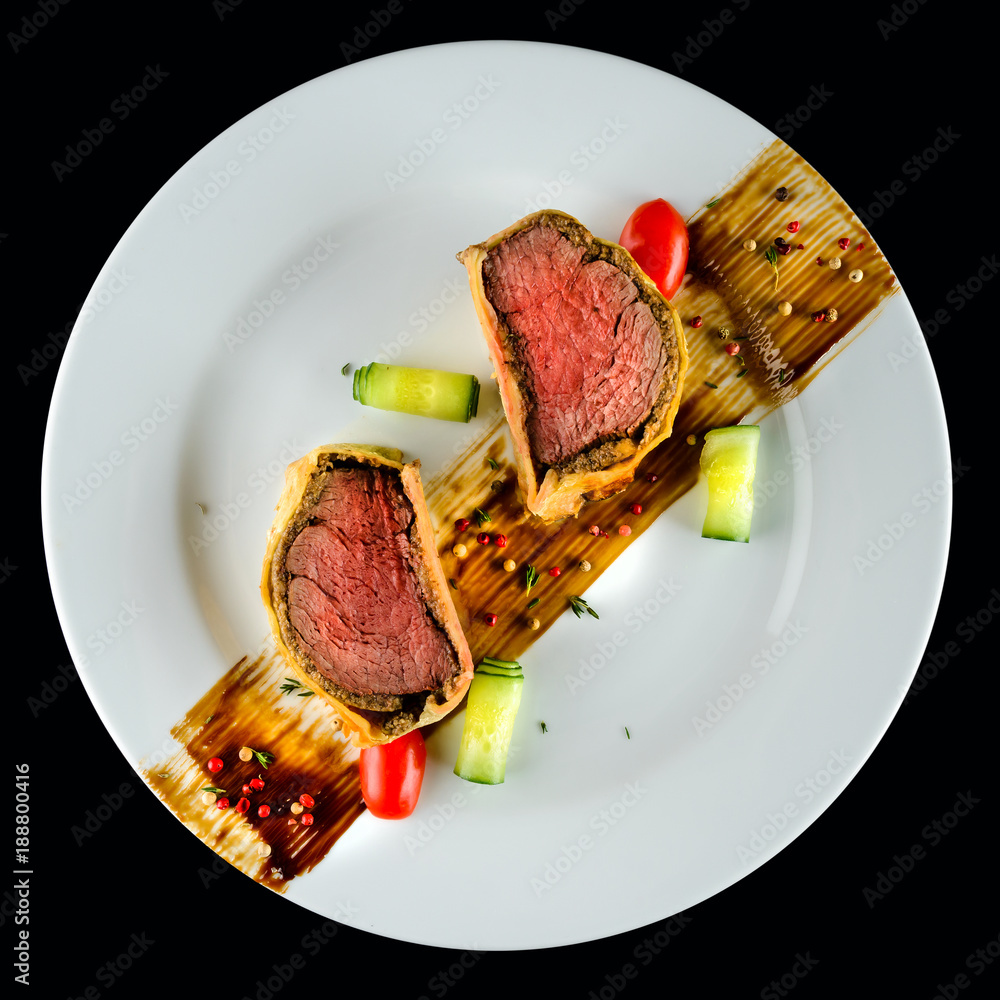 Homemade beef Wellington with a pastry crust, classic steak dish. Top