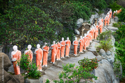 Statues of monks in Golden cave temple in Dambulla, Sri Lanka photo