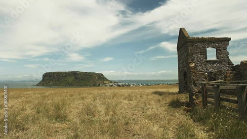 panning shot of the ruins of convict quarters at highfield in stanley, tasmania, australia photo