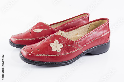 Female red leather shoe on white background, isolated product, footwear.
