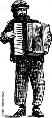 A street musician plays the accordion