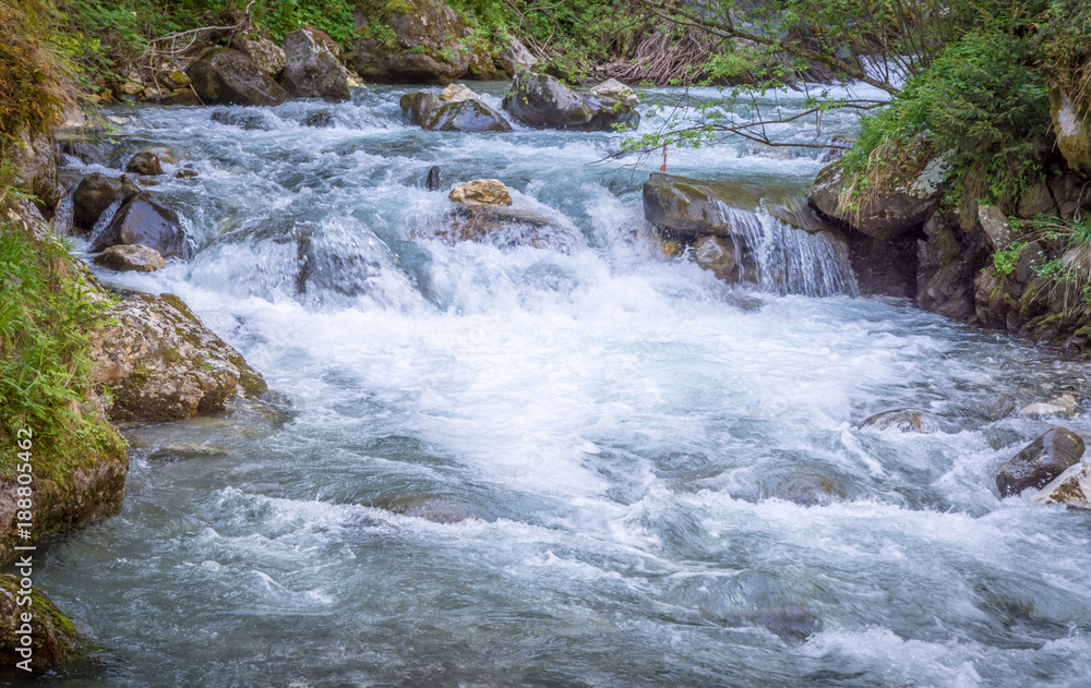 Fototapeta premium Waterfalls Stanghe (Gilfenklamm) localed near Racines, Bolzano in South Tyrol, Italy. Wooden bridges and runways lead through the canyon and give a spectacular sight to the waterfalls.