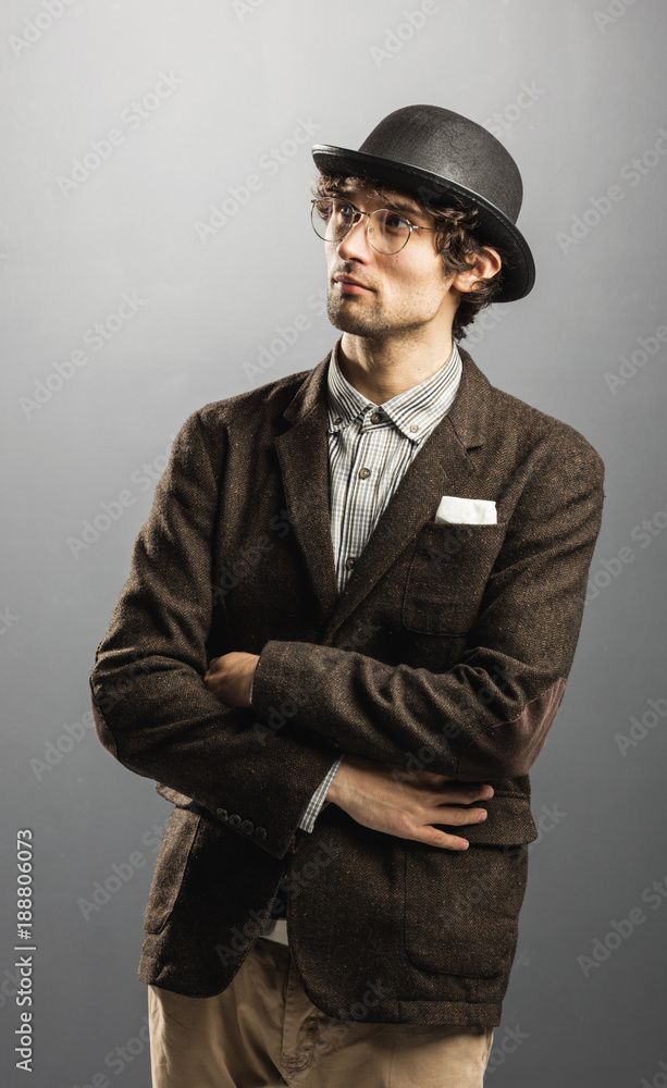 Pensive man in retro clothes staring at the space. Pensive man in retro clothes staring at the space.