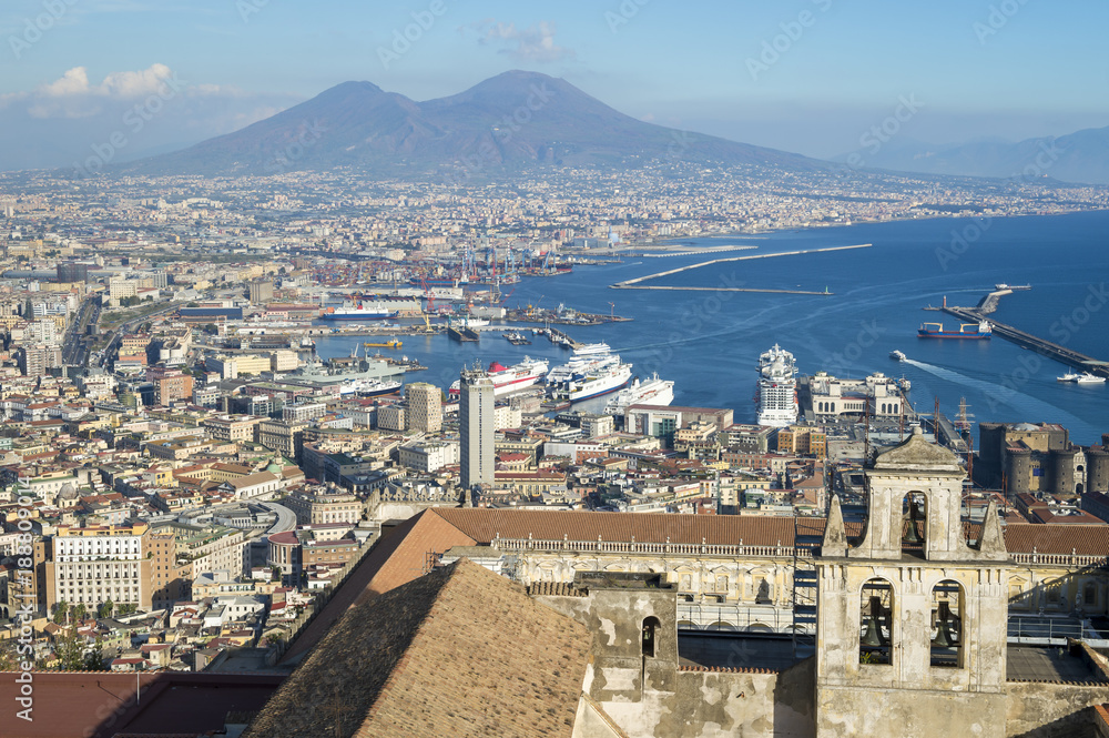 Scenic skyline view over the historic center of Naples, Italy with a view of Mount Vesuvius in the background