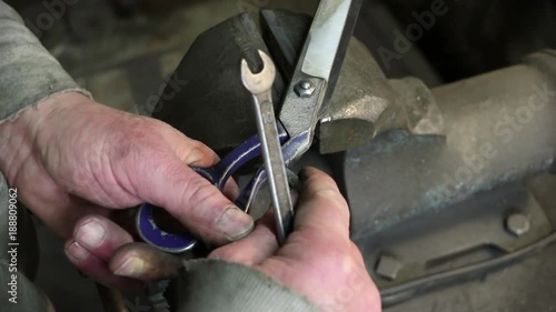 Man recompose scissors after sharpening photo