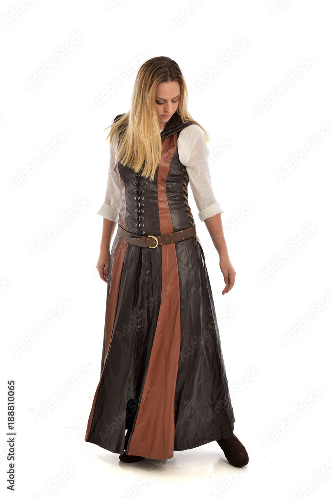 full length portrait of girl wearing brown fantasy costume. standing pose on white studio background. full length portrait of girl wearing brown fantasy costume. standing pose on white studio background.