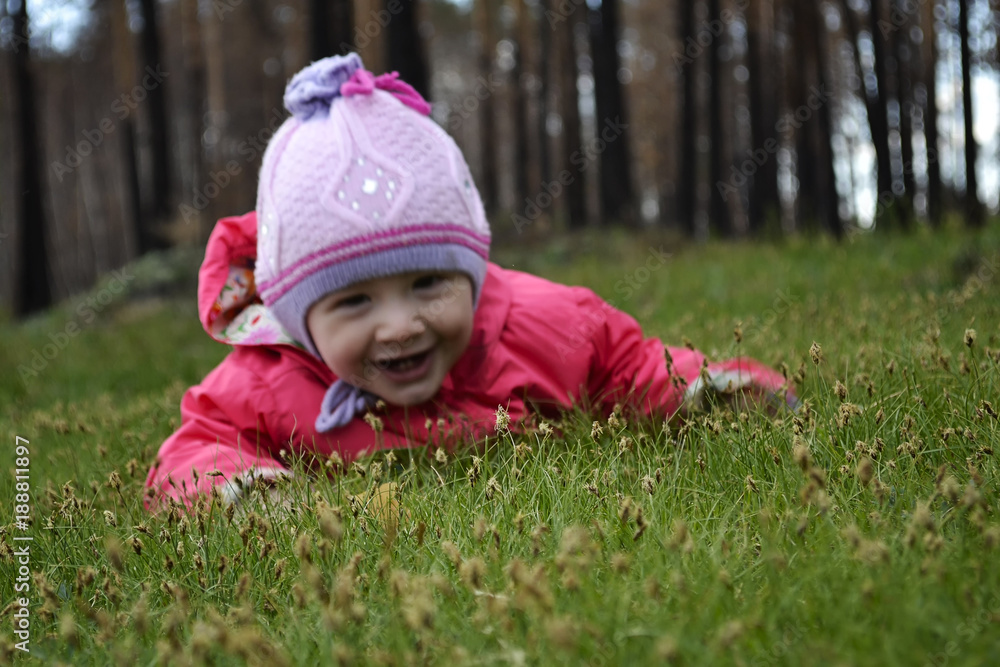 Little adorable girl lying on grass Little adorable girl lying on grass