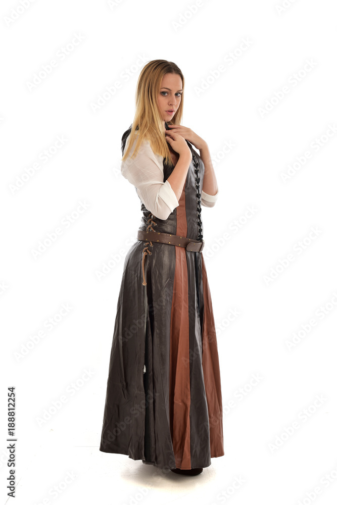 full length portrait of girl wearing brown  fantasy costume. standing pose on white studio background. 